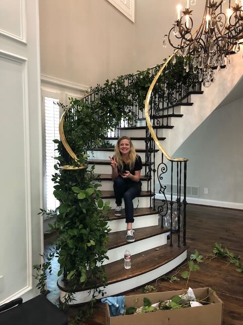 Woman Decorating Spiral Staircase